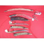 A Kukri knife set and three Indian sabre style blades (4)
