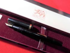 A Conway Stewart fountain pen with a 14 carat gold nib, boxed.