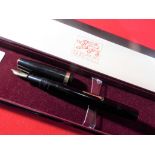 A Conway Stewart fountain pen with a 14 carat gold nib, boxed.