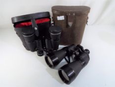 Two pairs of binoculars both cased,