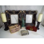 Two good quality Marks & Spencer photograph frames, a pair of candlesticks,