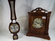 A good quality oak cased mantel clock and a wall barometer (2)