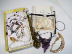 A good collection of costume jewellery to include a white metal charm bracelet containing eighteen