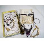 A good collection of costume jewellery to include a white metal charm bracelet containing eighteen