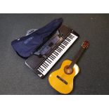 A beginners guitar bearing paper label marked Herald model MG104M contained in a soft carry case by