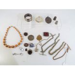 A good mixed lot to include a Mourning Locket, napkin ring stamped 925, watch chains,