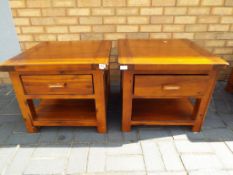 A matching pair of hardwood side tables with single drawer,