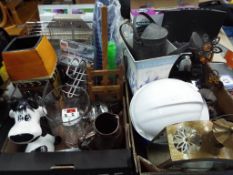 Two boxes of miscellaneous household items to include a Petsave dog flap, drill bit sharpener,