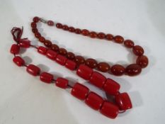Amber - two pairs of graduated beaded necklaces to include a Bakelite Amber necklace,