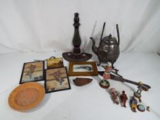 A good mixed lot to include a white metal teapot, a collection of Indian figures, decorative plate,