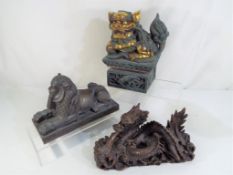 Three figures depicting a Buddha,