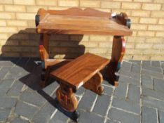 A child's wooden carved desk depicting teddy bears with a matching stool,