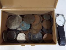 A small quantity of UK and Foreign coins and a wristwatch