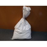 A large sealed sack containing approximately 23 kg of pre-owned unsorted costume jewellery.