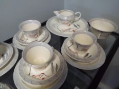 A good quality Art Deco tea service by Barratts of Staffordshire to include six trios, creamer,