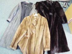 A good quality lady's full length fur coat with silk embroidered lining and slip pockets,