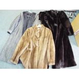 A good quality lady's full length fur coat with silk embroidered lining and slip pockets,