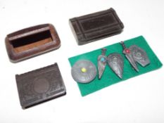 Three snuff boxes and a set of five pin badges