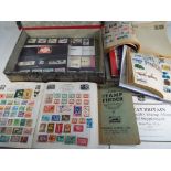 Philately - two albums containing UK and world postage stamps and a collection of UK mint stamps