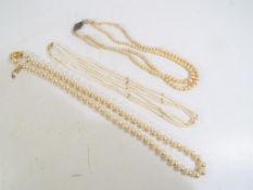 Pearls - a good quality set of triple stranded sea pearls with 14 carat gold clasp,