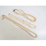 Pearls - a good quality set of triple stranded sea pearls with 14 carat gold clasp,