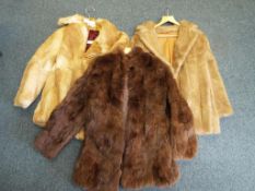 A lady's fur jacket size 18 and two further fur jackets (3)