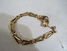 A lady's 9ct gold bracelet with safety chain stamped 375 (a/f), approx weight 8.