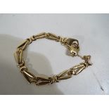 A lady's 9ct gold bracelet with safety chain stamped 375 (a/f), approx weight 8.