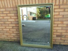 A good quality bevel edged wall mirror including frame approx 87cm x 113cm - This lot MUST be paid