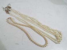 Pearls - a pair of good quality Ciro pearls with a 9 carat gold clasp and a pair of triple stranded