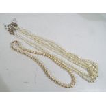 Pearls - a pair of good quality Ciro pearls with a 9 carat gold clasp and a pair of triple stranded