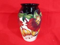 Moorcroft Pottery - a Moorcroft vase decorated in the Anna Lily pattern,