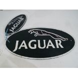 Two cast iron advertising wall plaques, largest 18 cm x 35 cm,