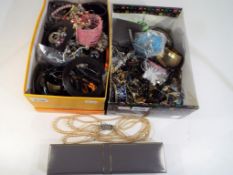 Two boxes of costume jewellery to include bangles,