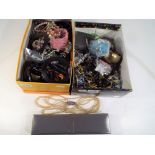 Two boxes of costume jewellery to include bangles,