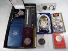 A mixed lot to include an Edinburgh crystal desk-top clock, two promotional Parker ballpens,