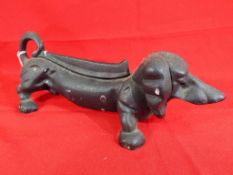A novelty cast iron shoe scrapper in the form of a dachshund