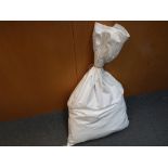 A large sealed sack containing approximately 23 kg of pre-owned unsorted costume jewellery.