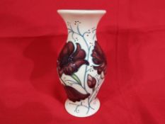 Moorcroft Pottery - a Moorcroft vase decorated in the Cosmos pattern approx 13cm (h) Est £50 - £80