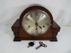 A good quality oak cased mantel clock with Westminster chime,