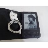 An Amazon Kindle with charge lead Est £20 - £30