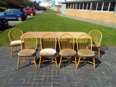 Ercol - an Ercol Windsor refectory / dining table with six hoop-backed chairs with detachable