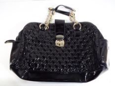 Designer handbags - a Jaeger lady's patent leather handbag bearing internal logo