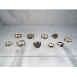 Six silver rings predominantly stamped 925 and a further three white metal rings