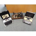 A good quality Singer sewing machine and two typewriters in travel cases (3)