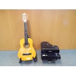 A Palma PL12 child's acoustic guitar with stand and a Hohner child's toy electric piano (3)