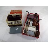 A good mixed lot to include four smoker's pipes, cigarette lighters by Hadson, Zippo,