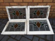 Four leaded glass windows in frames appr