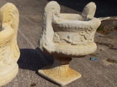 A large twin handled stone urn, Est £25
