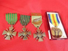 Four WWI (World War One) medals with rib